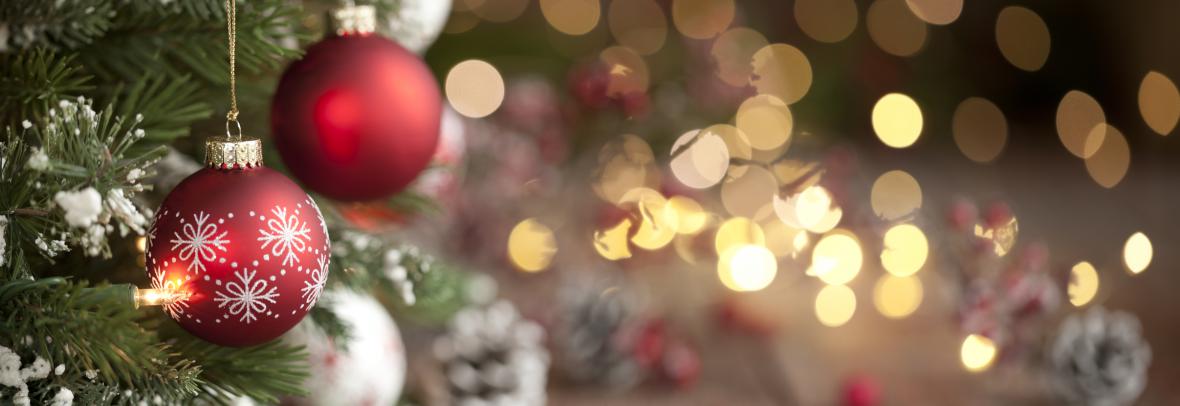 Christmas tree with red and white ornaments and defocused white lights